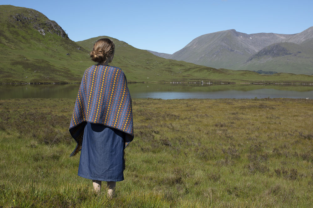 Gypsy Moth Wrap hand knitwear design in blue colourway from the book A Collector's Item by Jade Starmore