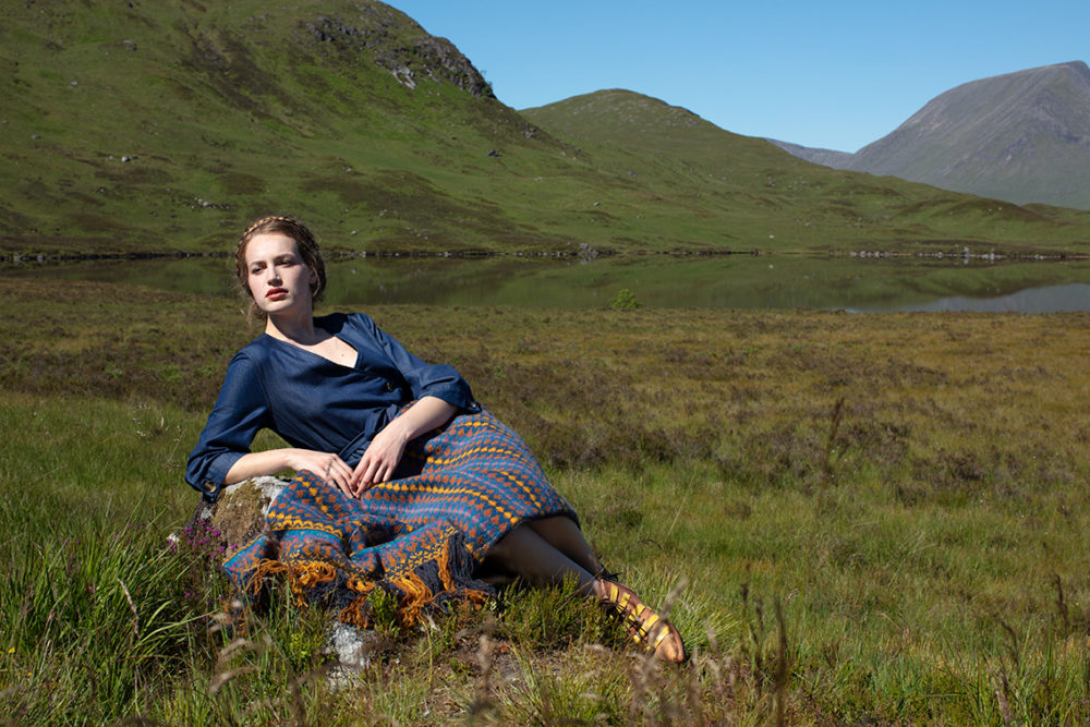 Gypsy Moth Wrap hand knitwear design in blue colourway from the book A Collector's Item by Jade Starmore