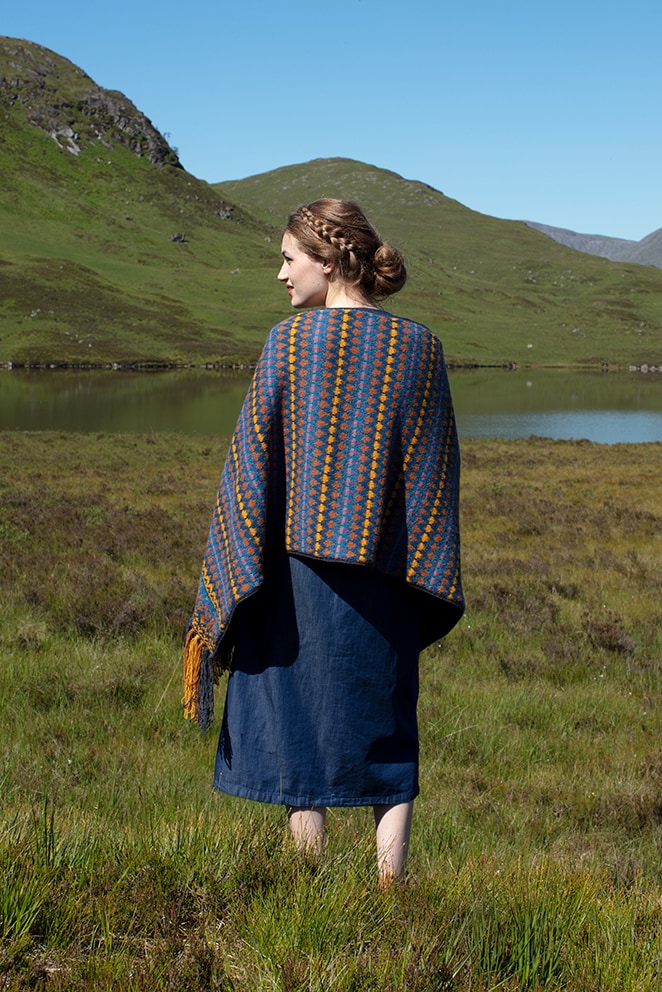 Gypsy Moth Wrap hand knitwear design in blue colourway from the book A Collector's Item by Jade Starmore