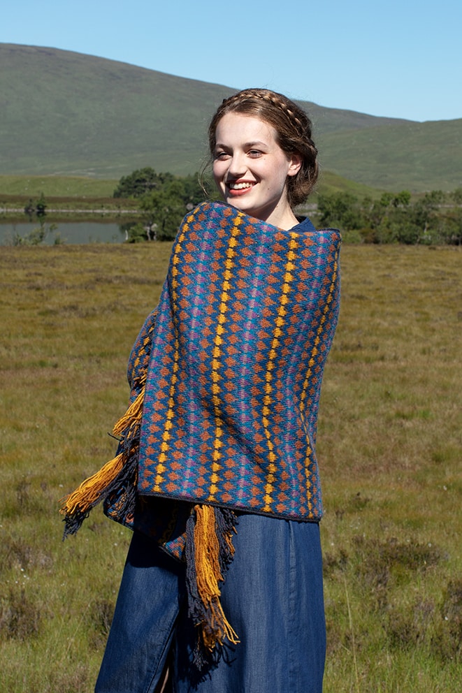 Gypsy Moth Wrap hand knitwear design in blue colourway from the book A Collector's Item by Jade Starmore