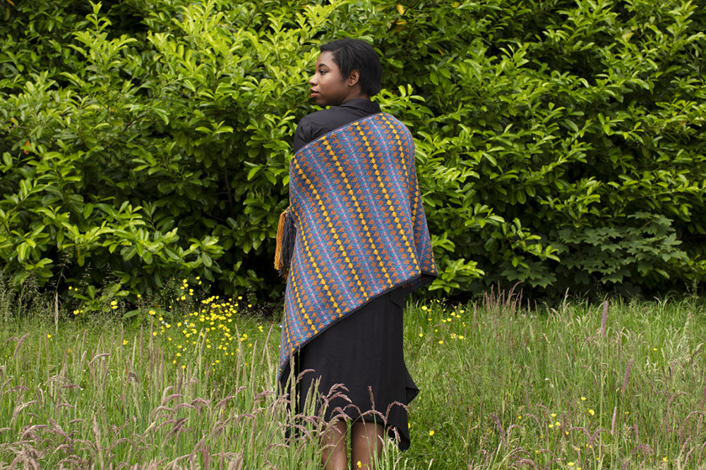 Gypsy Moth Wrap hand knitwear design in blue colourway from the book A Collector's Item by Jade Starmore