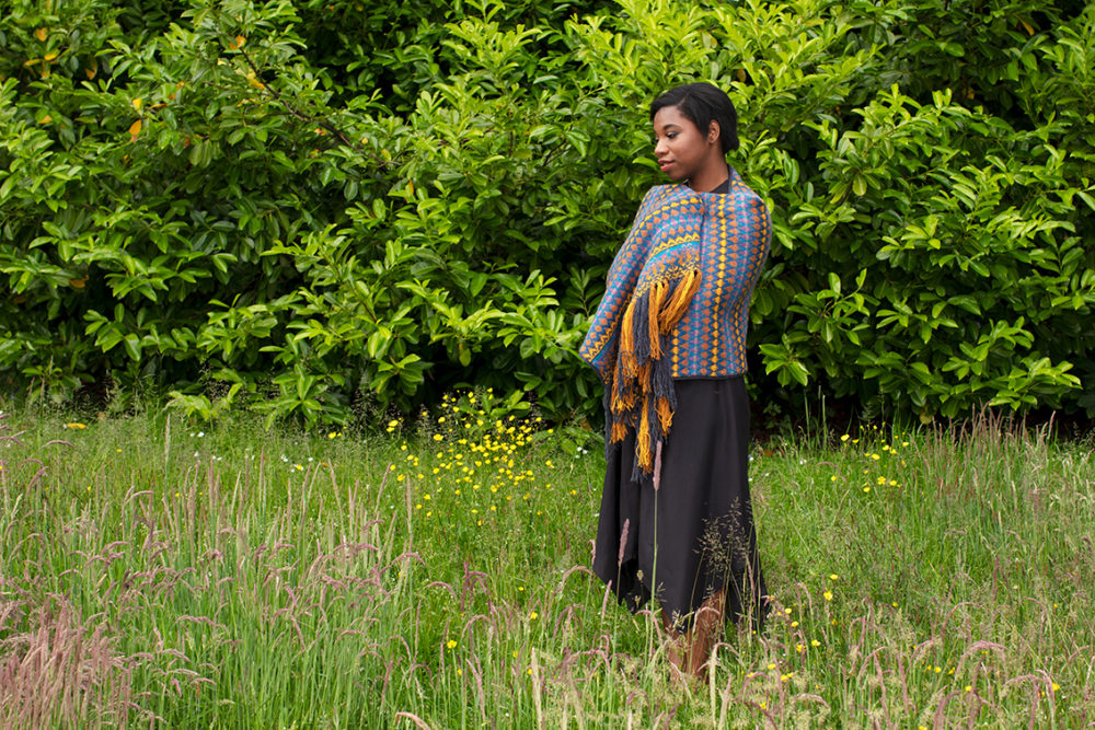 Gypsy Moth Wrap hand knitwear design in blue colourway from the book A Collector's Item by Jade Starmore