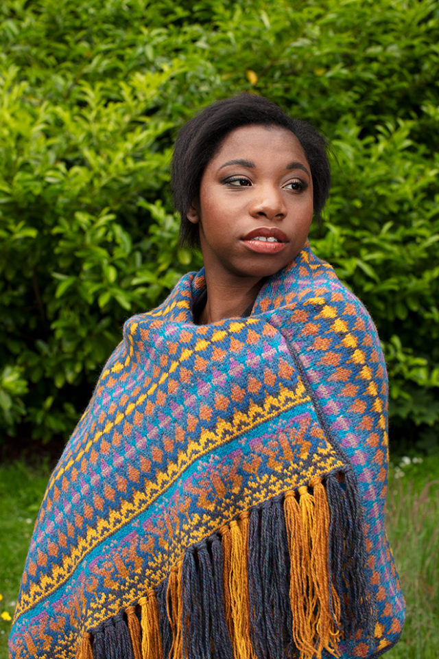 Gypsy Moth Wrap hand knitwear design in blue colourway from the book A Collector's Item by Jade Starmore