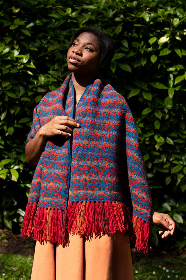 Suzani Wrap hand knitwear design in blue colourway from the book A Collector's Item by Jade Starmore