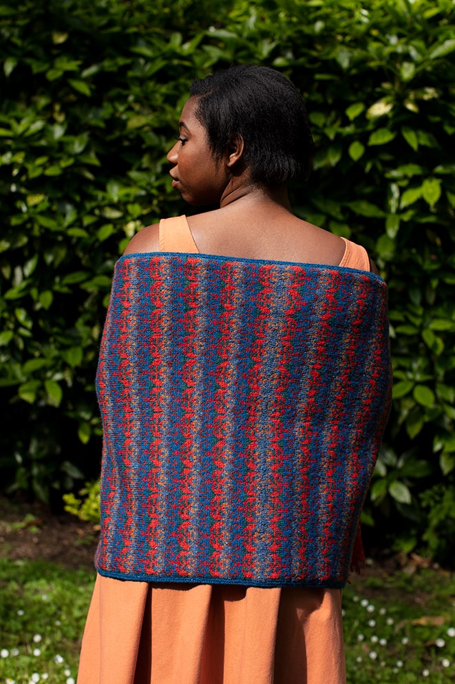 Suzani Wrap hand knitwear design in blue colourway from the book A Collector's Item by Jade Starmore