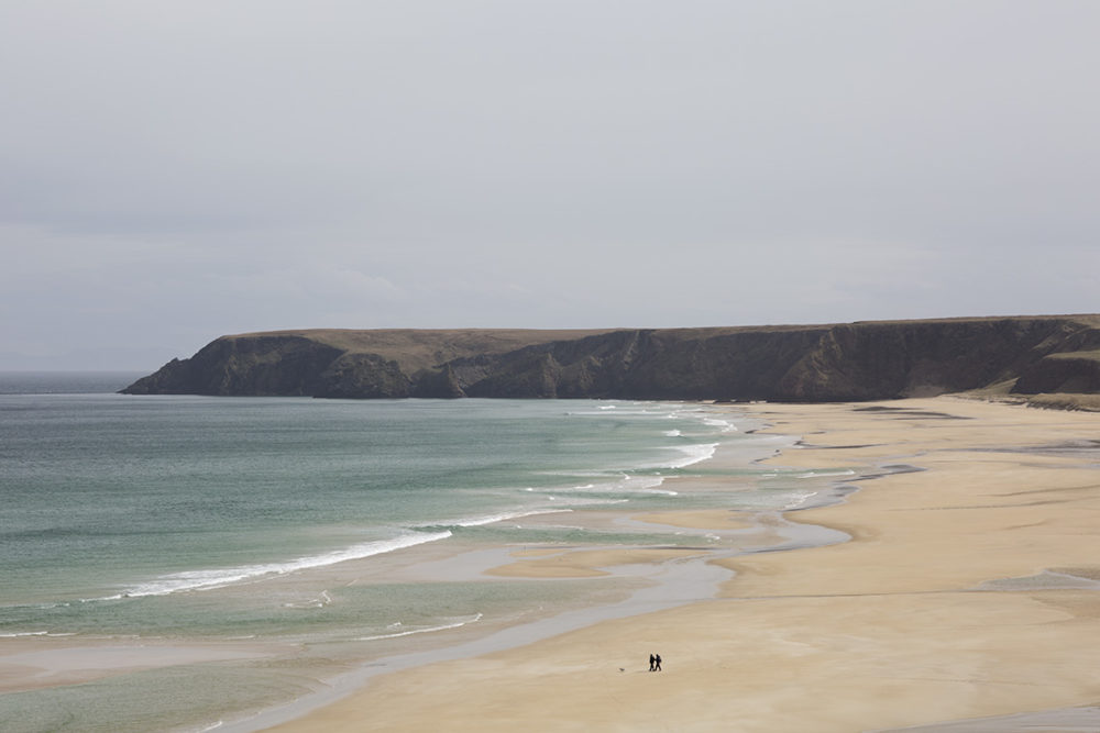 Walkers on a Lewis beach