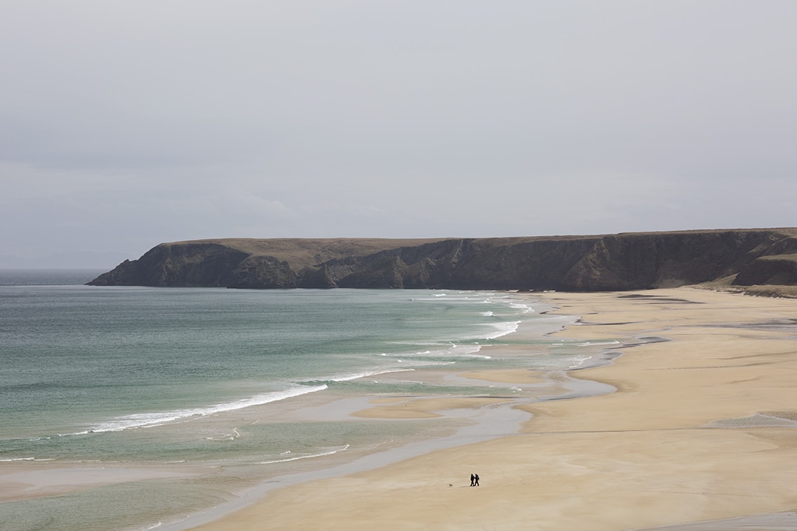 Walkers on a Lewis beach