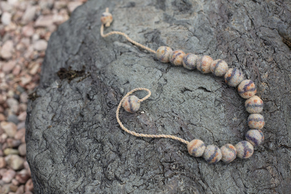 Felted pebble necklace designed by Alice Starmore