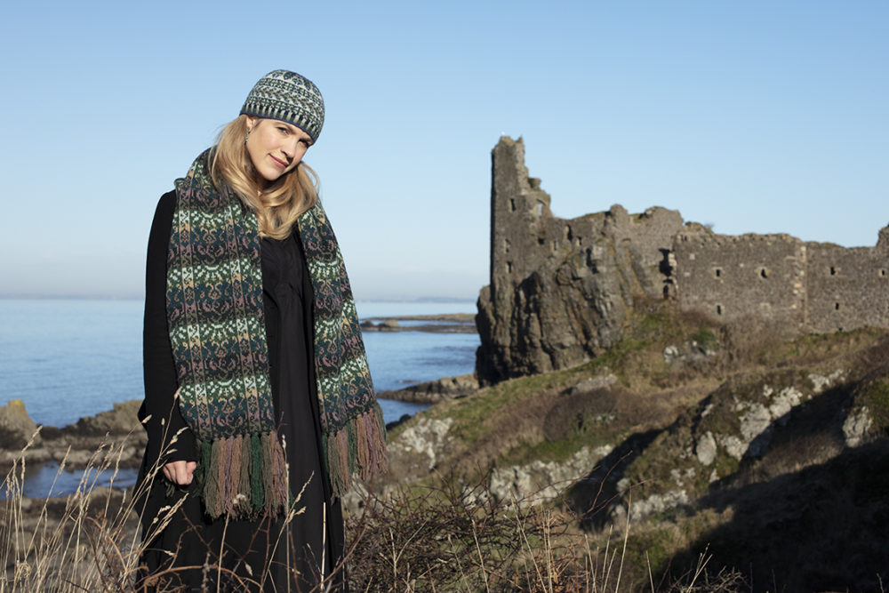 Musician Laura Durrant wearing the Rheingold wrap in green colourway and Hat Trick hat