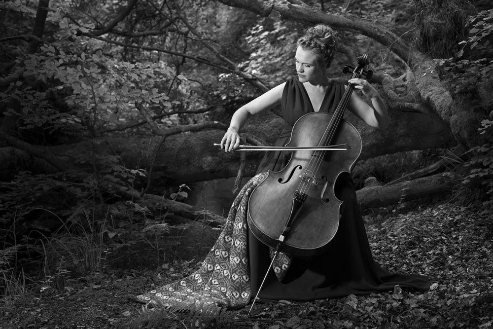 Musician Laura Durrant wearing the Lady Mary Wrap by Jade Starmore from the book Tudor Roses