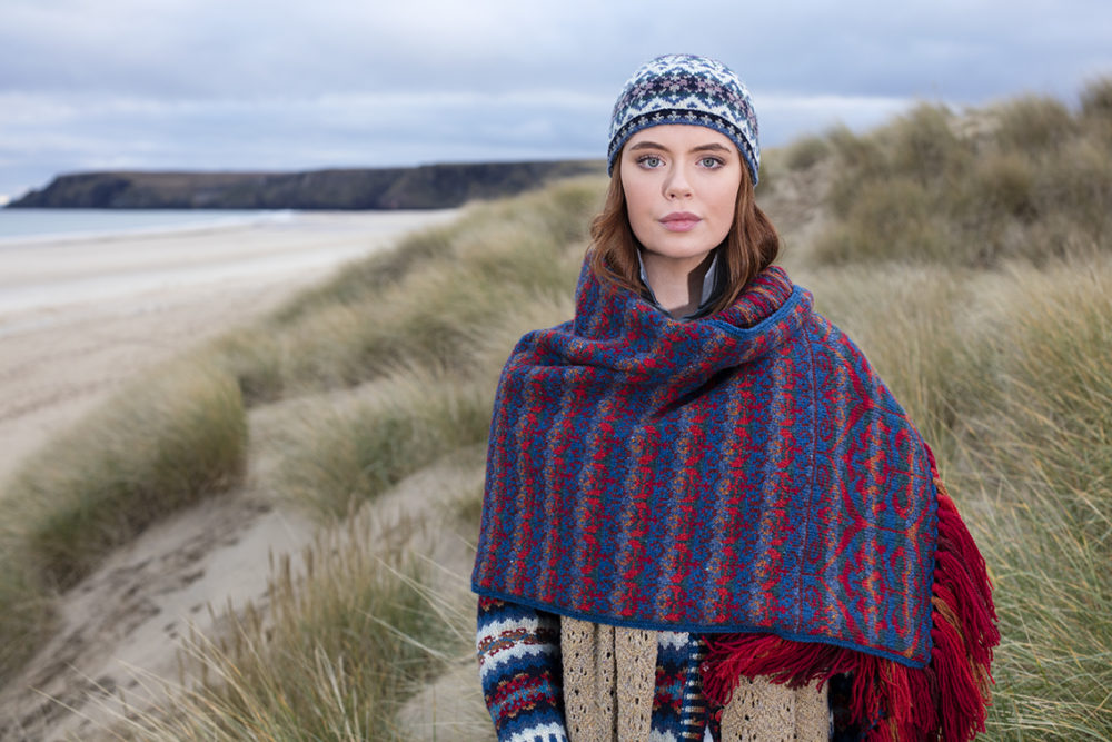 Suzani Wrap hand knitwear design in blue colourway from the book A Collector's Item by Jade Starmore