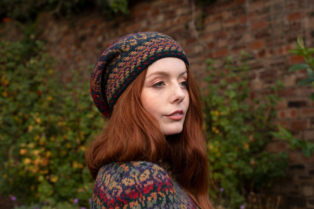 The Red Jacobite Rose Cardgian and Hat Set patterncard kit designs by Alice Starmore in Hebridean 2 Ply