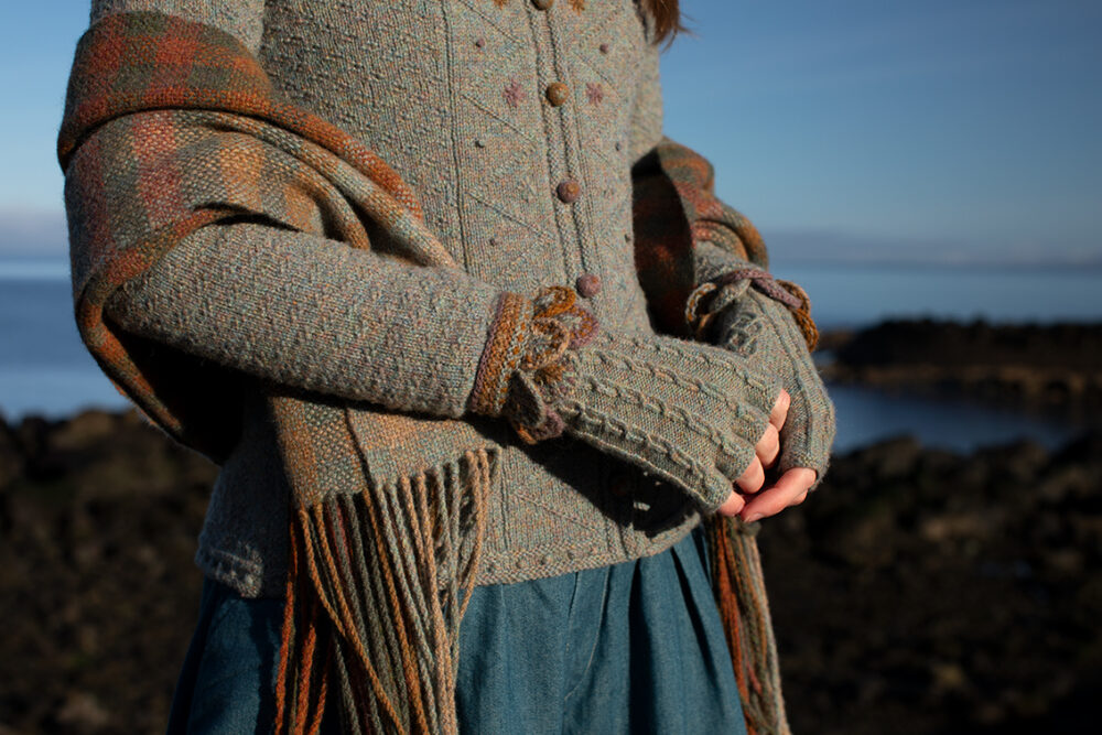The Ruabhal Hat Set and Oiseabhal patterncard kit designs and Mountain Hare Cardigan from Glamourie by Alice Starmore in Hebridean 2 Ply