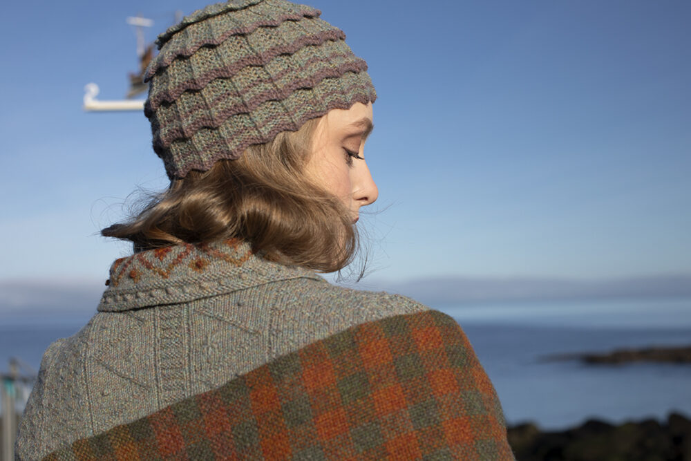 The Ruabhal gloves, Levenish Hat and Oiseabhal patterncard kit designs and Mountain Hare Cardigan from Glamourie by Alice Starmore in Hebridean 2 Ply