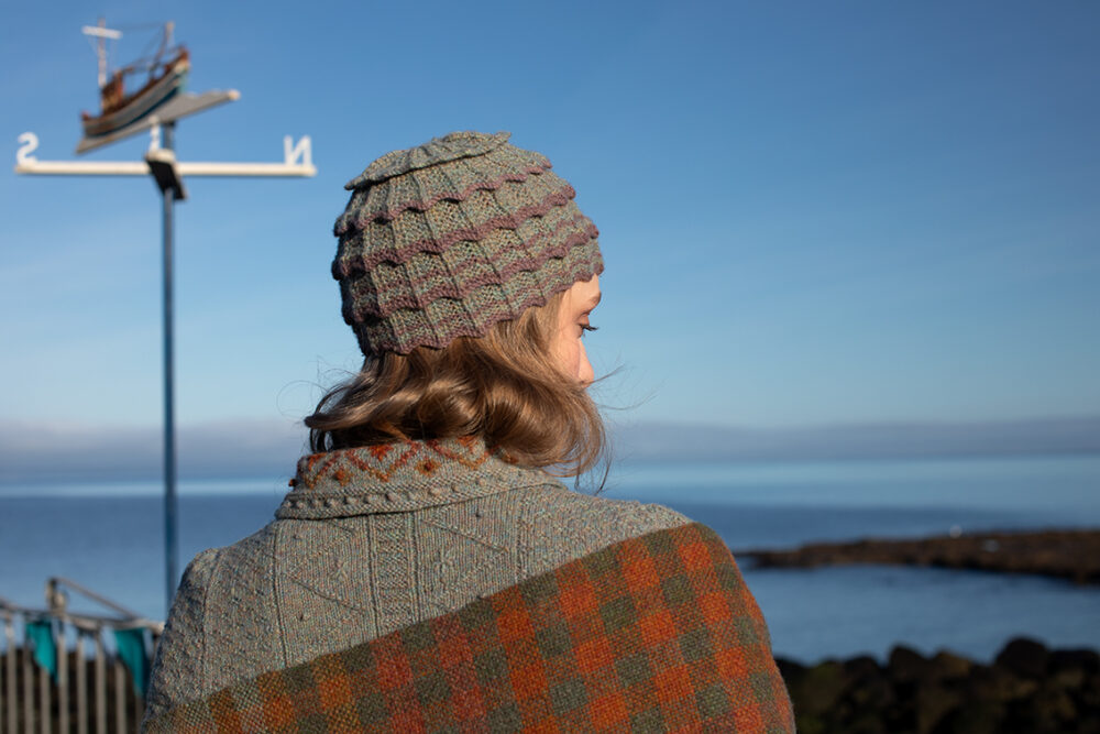 The Ruabhal gloves, Levenish Hat and Oiseabhal patterncard kit designs and Mountain Hare Cardigan from Glamourie by Alice Starmore in Hebridean 2 Ply