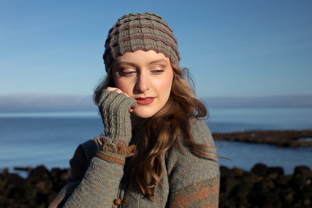 The Ruabhal gloves, Levenish Hat and Oiseabhal patterncard kit designs and Mountain Hare Cardigan from Glamourie by Alice Starmore in Hebridean 2 Ply