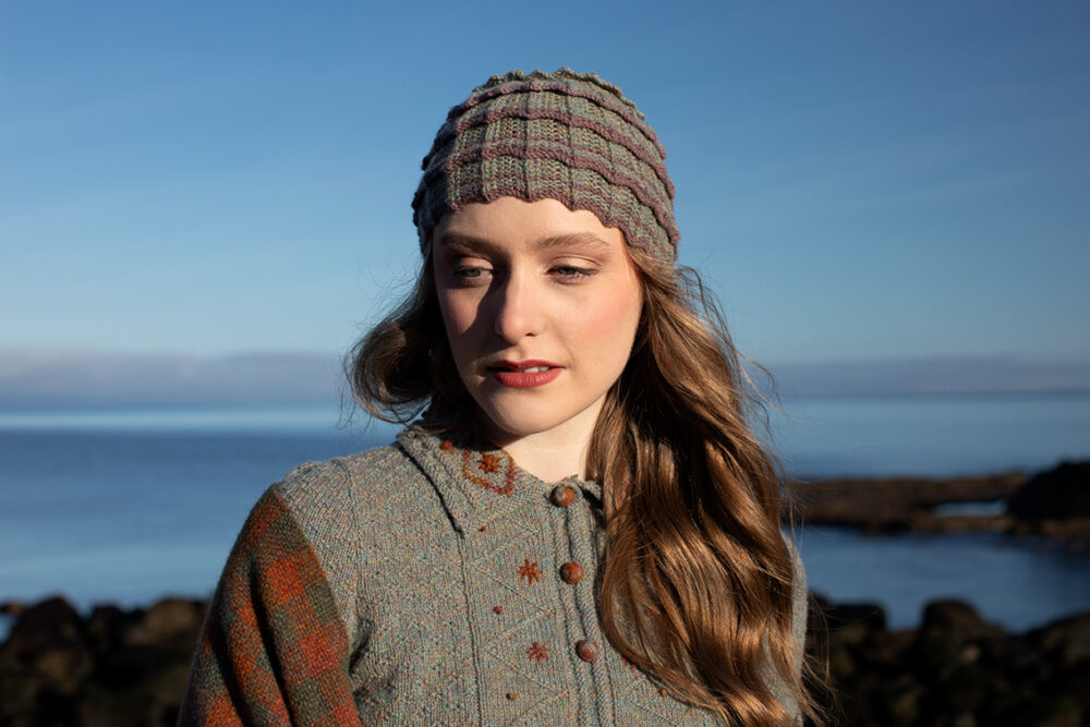 The Ruabhal gloves, Levenish Hat and Oiseabhal patterncard kit designs and Mountain Hare Cardigan from Glamourie by Alice Starmore in Hebridean 2 Ply