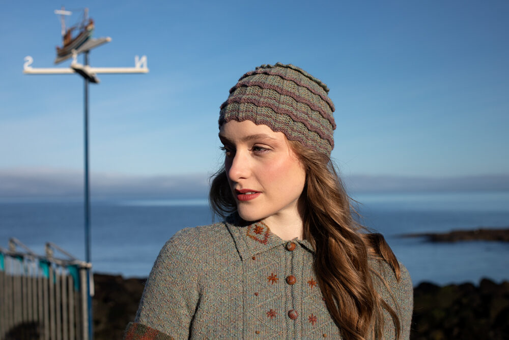 The Ruabhal gloves, Levenish Hat and Oiseabhal patterncard kit designs and Mountain Hare Cardigan from Glamourie by Alice Starmore in Hebridean 2 Ply