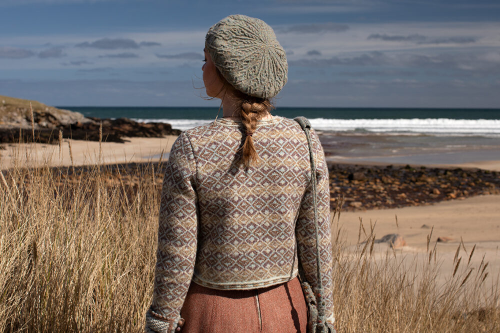 The Delta Cardigan, Ruabhal Hat Set and Oiseabhal patterncard kit designs and Dun Cuff from Creative Course 2 and Sporran Bag from Creative Course 3 by Alice Starmore in Hebridean 2 Ply
