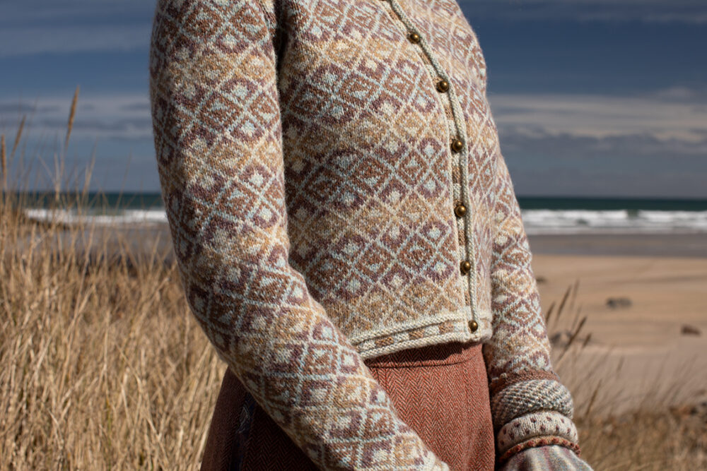 The Delta Cardigan, Ruabhal Hat Set and Oiseabhal patterncard kit designs and Dun Cuff from Creative Course 2 and Sporran Bag from Creative Course 3 by Alice Starmore in Hebridean 2 Ply
