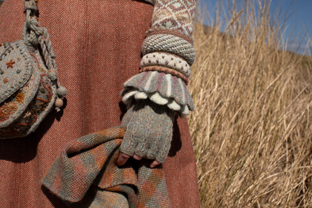 The Delta Cardigan, Ruabhal Hat Set and Oiseabhal patterncard kit designs and Dun Cuff from Creative Course 2 and Sporran Bag from Creative Course 3 by Alice Starmore in Hebridean 2 Ply