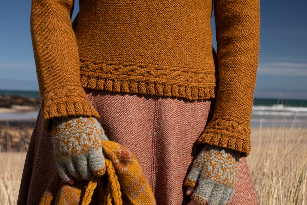The Eightsome Reel hand knitwear patterncard kit design by Alice Starmore in Hebridean 3 Ply, worn with the Hirta Hat Set patterncard kit in Hebridean 2 ply.