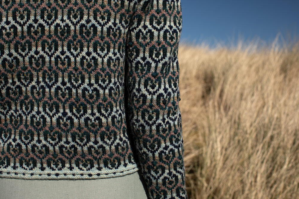 The Loch Lomond cardigan, St Agnes Eve Beret and Scarf and Ruabhal gloves hand knitwear patterncard kit designs by Alice Starmore made in Hebridean 2 Ply
