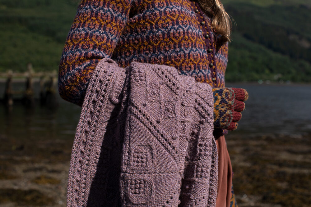 The Loch Lomond Cardigan by Jade Starmore and the Henry VIII Hat Set by Alice Starmore, hand knitwear design patterncard kits in Hebridean 2 Ply and the Mo Chridhe Blanket from the Infinite Cable Class in Hebridean 3 Ply