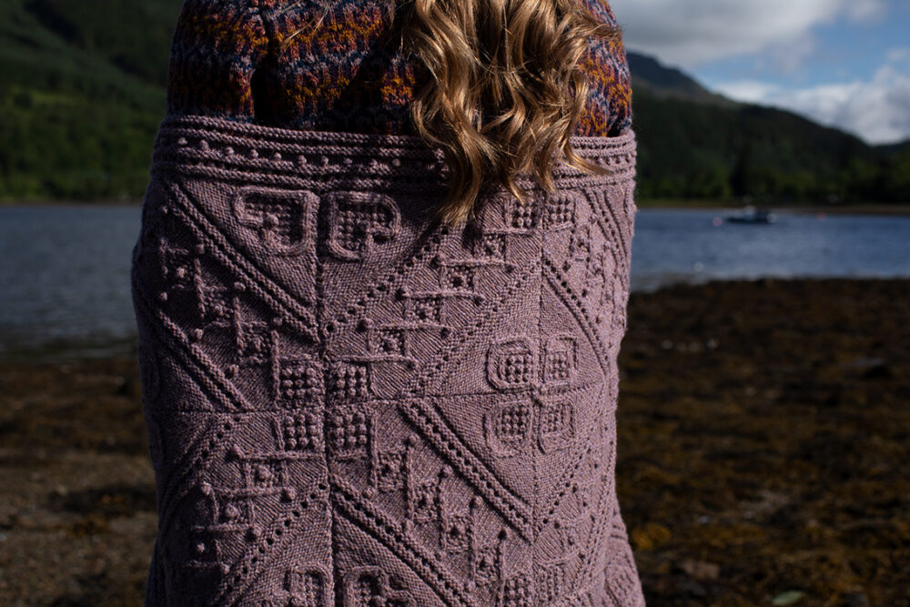 The Loch Lomond Cardigan by Jade Starmore and the Henry VIII Hat Set by Alice Starmore, hand knitwear design patterncard kits in Hebridean 2 Ply and the Mo Chridhe Blanket from the Infinite Cable Class in Hebridean 3 Ply