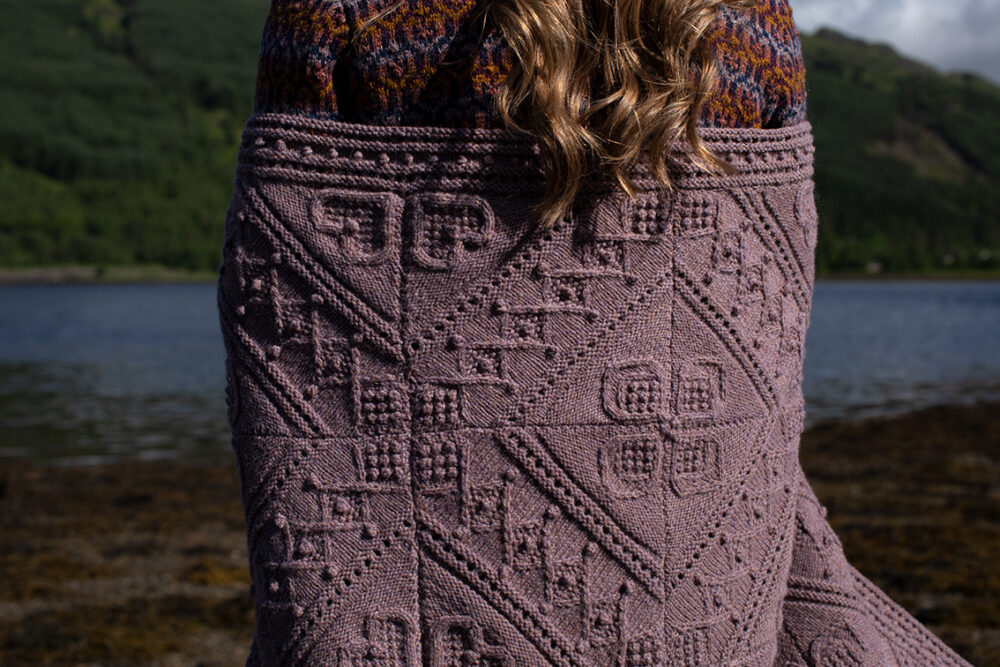 The Loch Lomond Cardigan by Jade Starmore and the Henry VIII Hat Set by Alice Starmore, hand knitwear design patterncard kits in Hebridean 2 Ply and the Mo Chridhe Blanket from the Infinite Cable Class in Hebridean 3 Ply