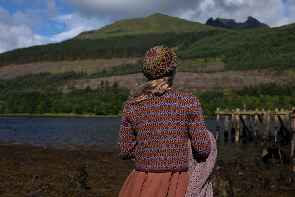 The Loch Lomond Cardigan by Jade Starmore and the Henry VIII Hat Set by Alice Starmore, hand knitwear design patterncard kits in Hebridean 2 Ply and the Mo Chridhe Blanket from the Infinite Cable Class in Hebridean 3 Ply