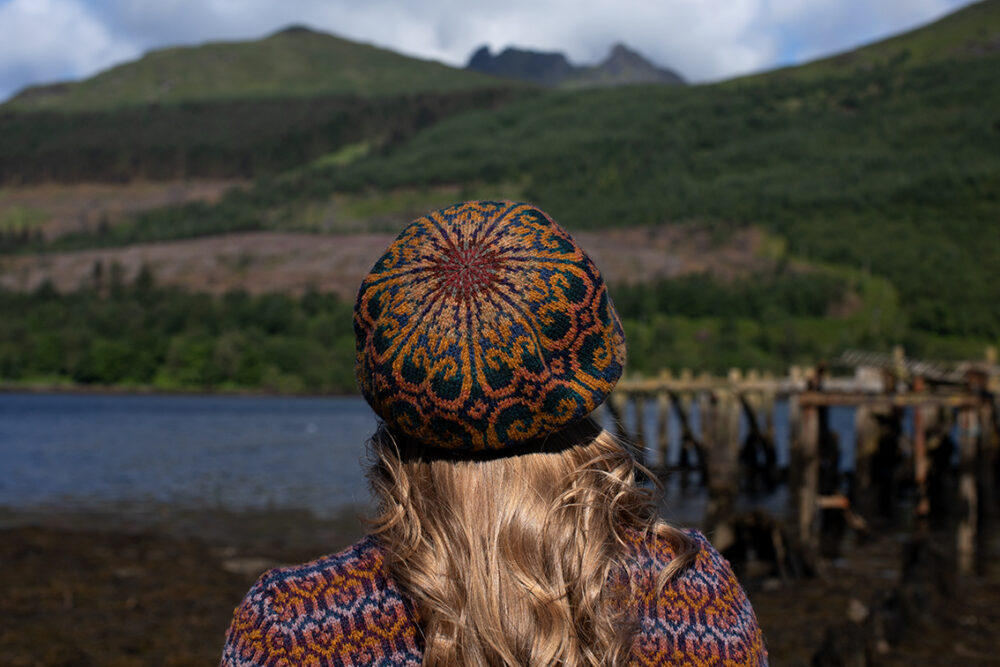 The Loch Lomond Cardigan by Jade Starmore and the Henry VIII Hat Set by Alice Starmore, hand knitwear design patterncard kits in Hebridean 2 Ply and the Mo Chridhe Blanket from the Infinite Cable Class in Hebridean 3 Ply