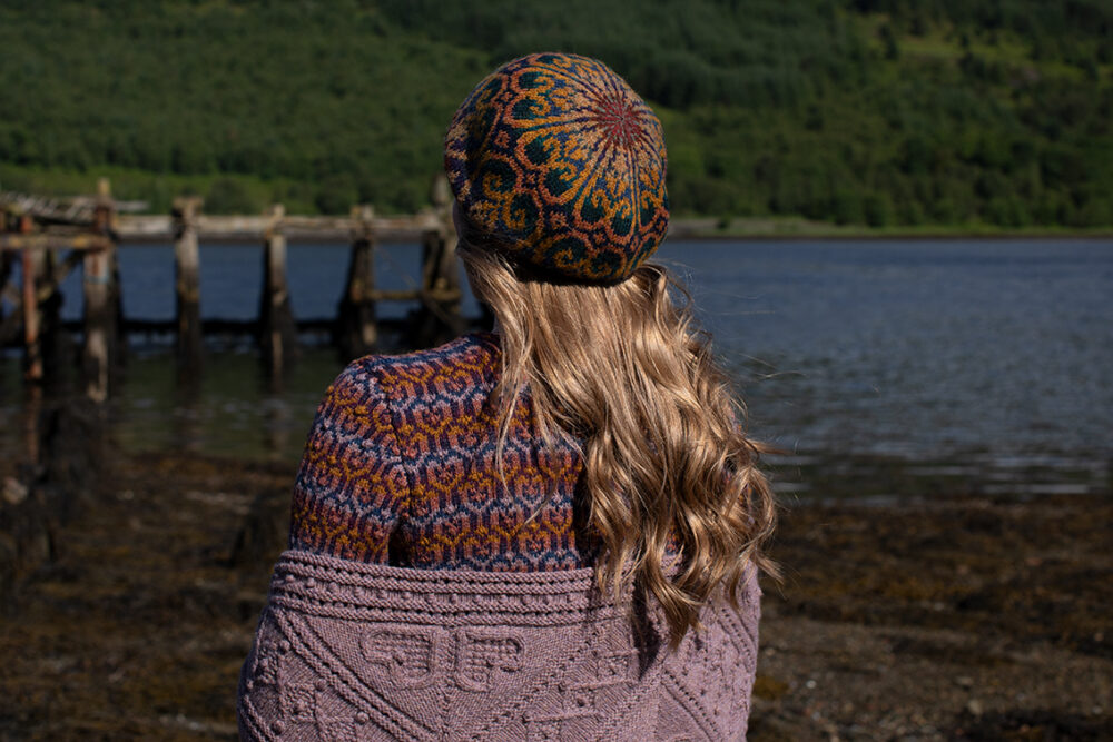 The Loch Lomond Cardigan by Jade Starmore and the Henry VIII Hat Set by Alice Starmore, hand knitwear design patterncard kits in Hebridean 2 Ply and the Mo Chridhe Blanket from the Infinite Cable Class in Hebridean 3 Ply