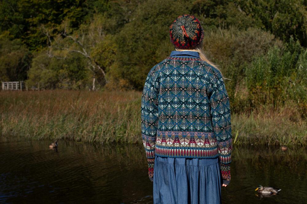 The Oregon Spring Cardigan and Red Jacobite Rose Hat Set patterncard kit designs by Alice Starmore in Hebridean 2 Ply