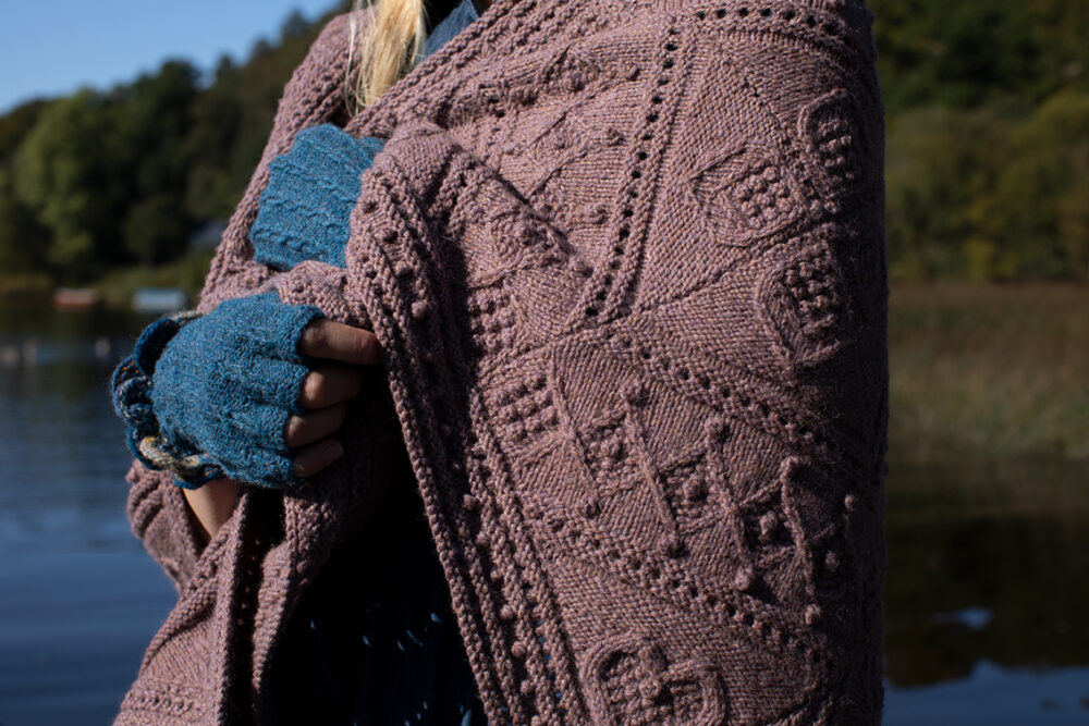 The Ruabhal Hat Set patterncard kit design by Alice Starmore in Hebridean 2 Ply and the Mo Chridhe blanket from the Infinite Cable Class in Hebridean 3 Ply
