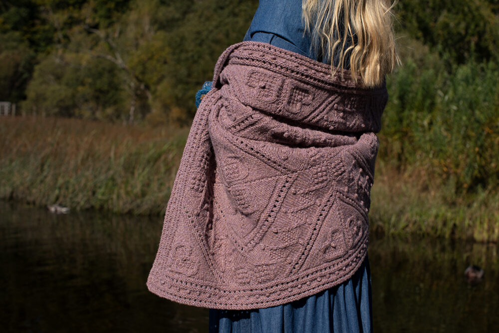 The Ruabhal Hat Set patterncard kit design by Alice Starmore in Hebridean 2 Ply and the Mo Chridhe blanket from the Infinite Cable Class in Hebridean 3 Ply
