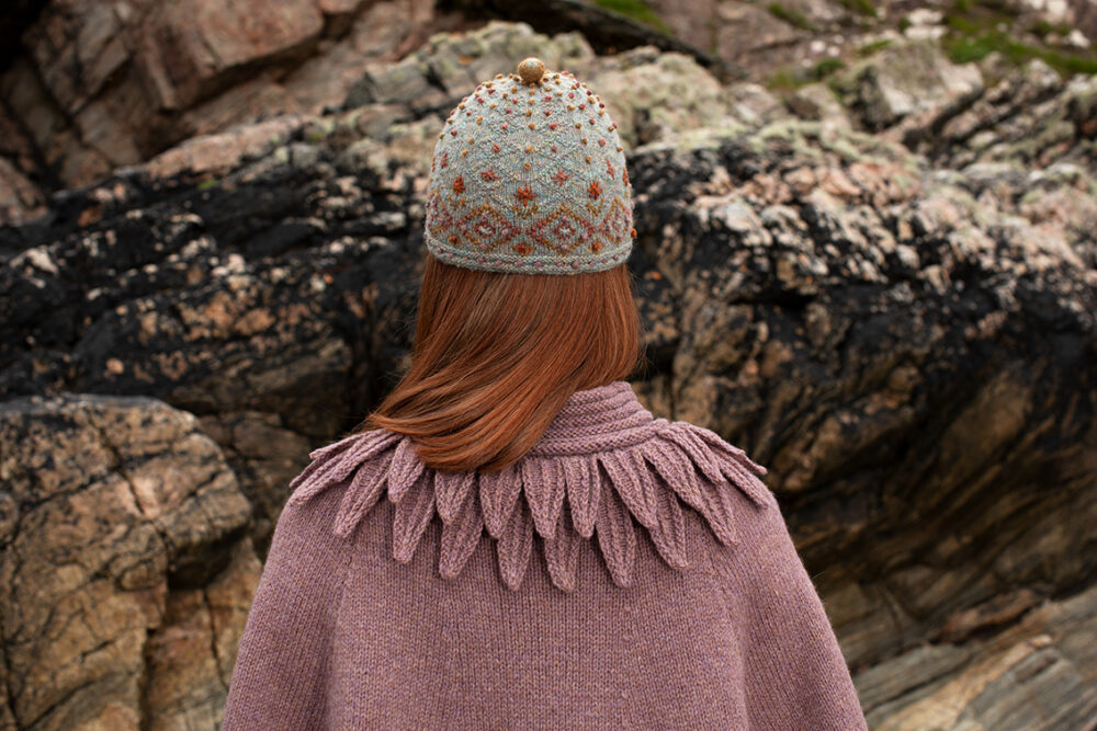 The Raven Poncho, Mountain Hare Hat and Hirta glvoes patterncard kit designs by Alice Starmore in Hebridean 2 & 3 Ply