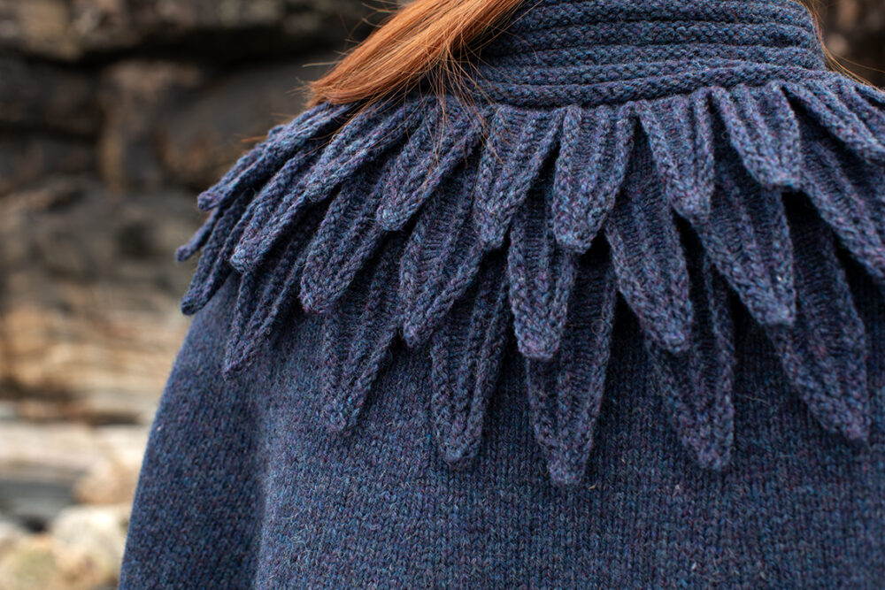 The Raven Poncho and Hirta Hat Set patterncard kit designs by Alice Starmore in Hebridean 2 & 3 Ply and a cuff from Creative Course 2