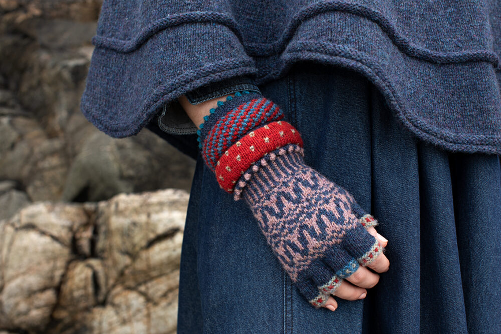 The Raven Poncho and Hirta Hat Set patterncard kit designs by Alice Starmore in Hebridean 2 & 3 Ply and a cuff from Creative Course 2
