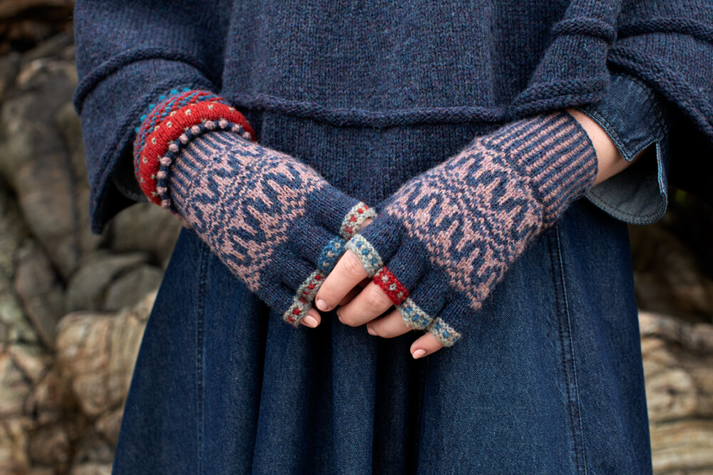 The Raven Poncho and Hirta Hat Set patterncard kit designs by Alice Starmore in Hebridean 2 & 3 Ply and a cuff from Creative Course 2