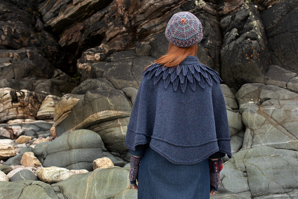 The Raven Poncho and Hirta Hat Set patterncard kit designs by Alice Starmore in Hebridean 2 & 3 Ply and a cuff from Creative Course 2