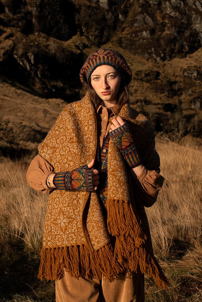 Persian Tiles patterncard kit design by Jade Starmore and the Oregon Autumn waistcoat and gloves and Mary Tudor Hat Set patterncard kit designs by Alice Starmore, knitted in Hebridean 2 Ply